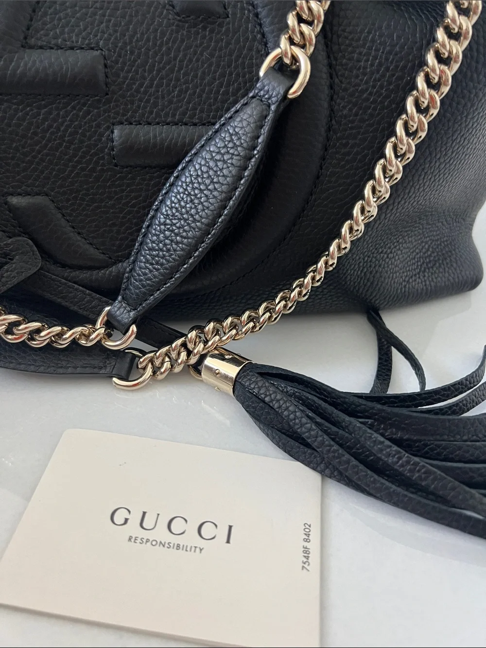 Gucci interlocking GG Black Soho Leather Shoulder Bag with Gold Chain and Tassel